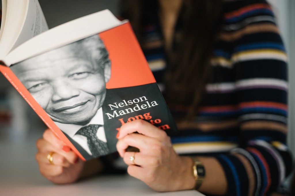 Person reading Nelson Mandela - A long walk to freedom