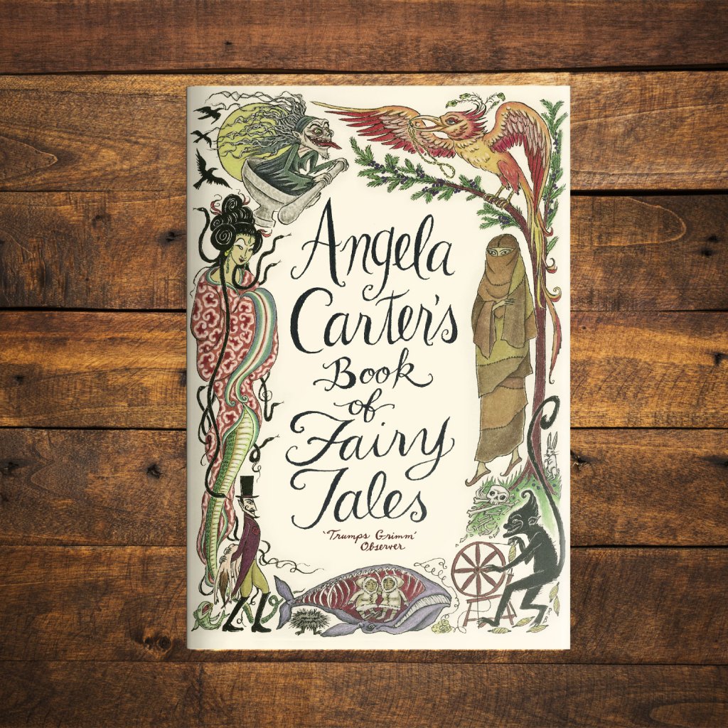 Angela Carter's Book of Fairy Tales on a dark wood background