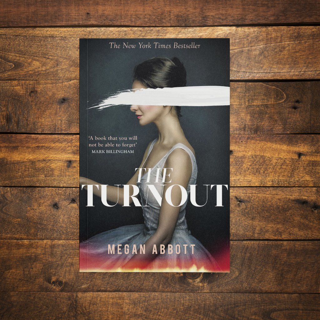 The Turnout by Megan Abbott on a dark wood background