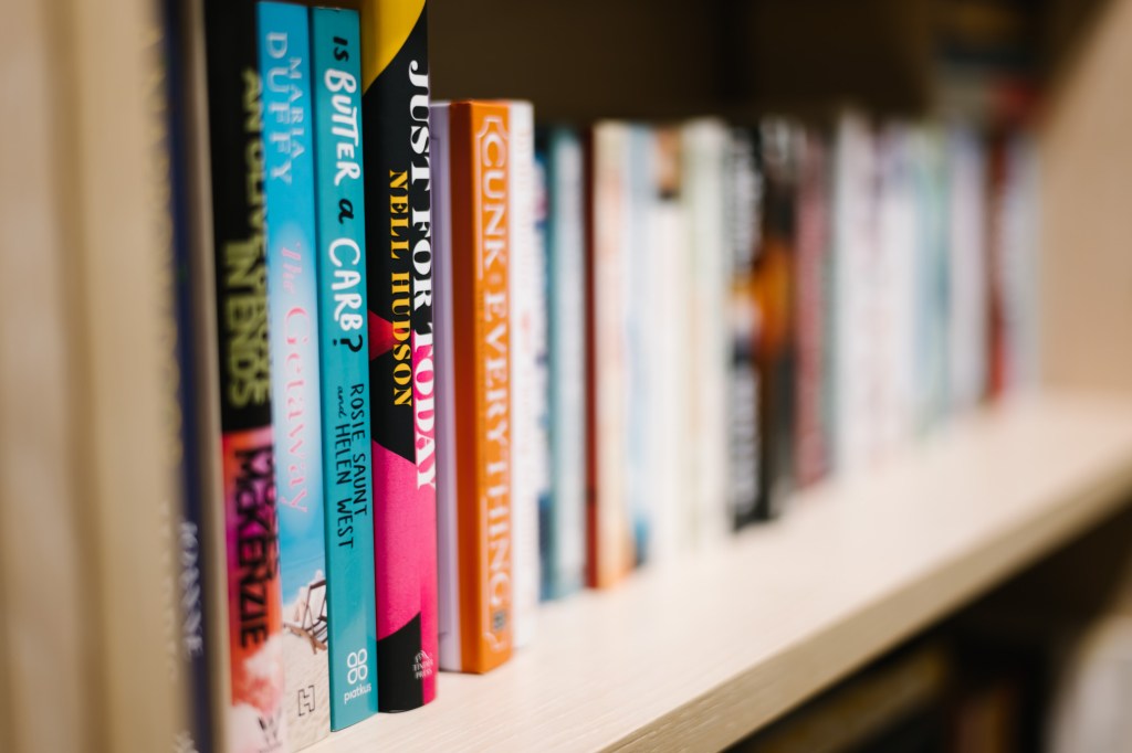 Books stacked on a shelf